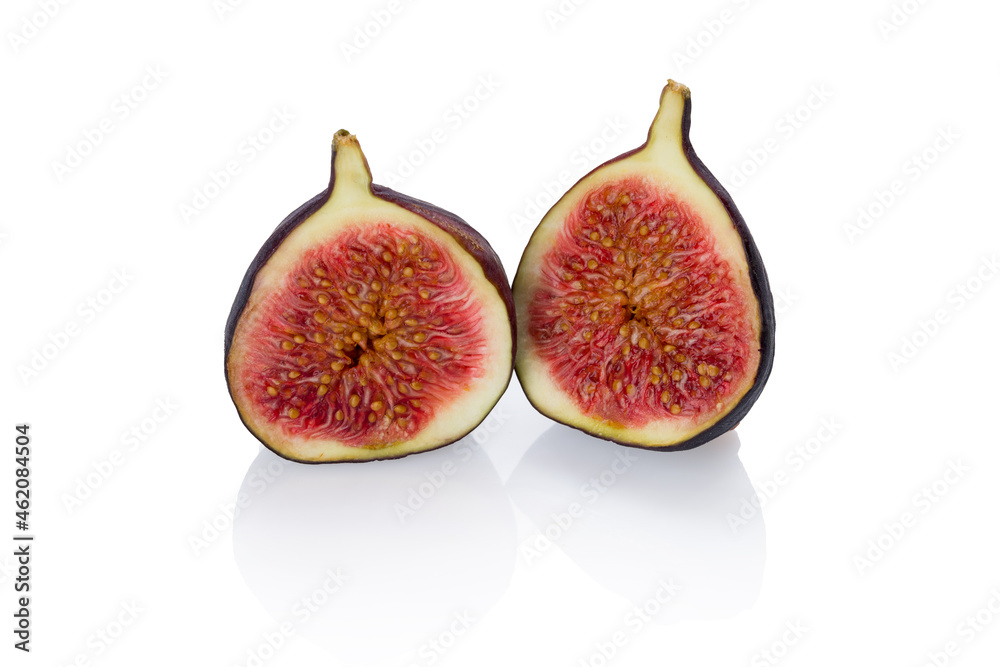 sliced fresh figs on a white background isolated, side view with reflection. sliced fresh figs on a white background isolated, side view with reflection.