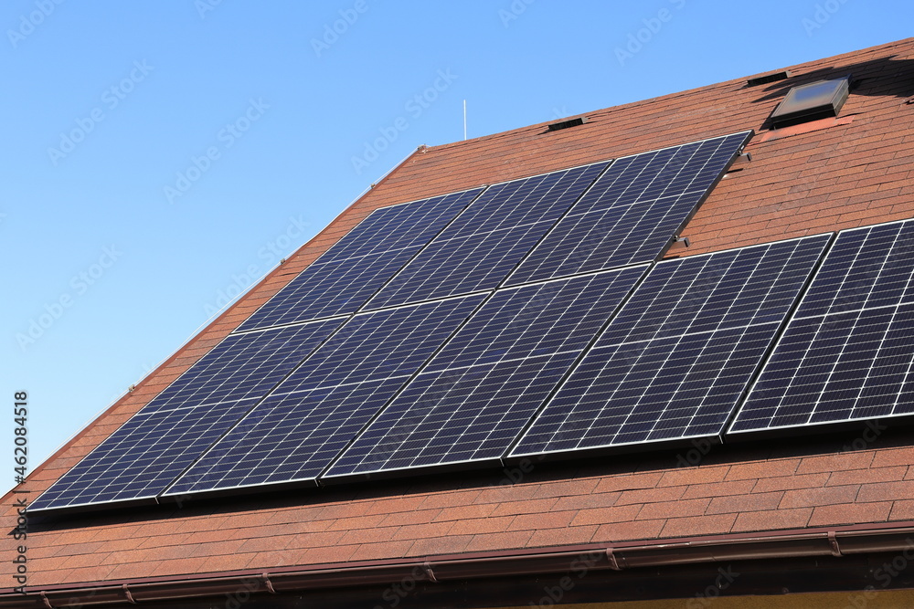 Photovoltaic power plant on the roof of the house. Green energy. Self-sufficient house.