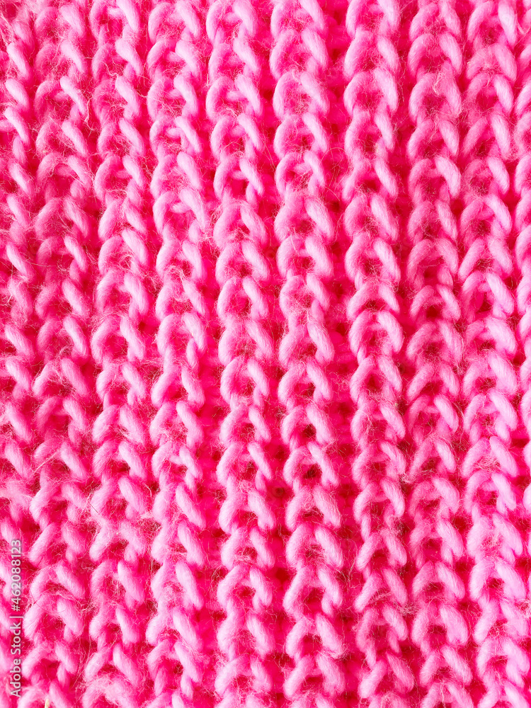 pink knitted background. pigtail texture