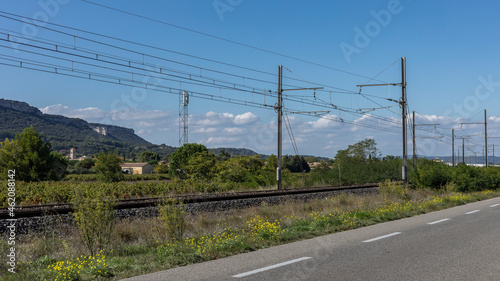 Railway line with yellow wild flowers in Provence