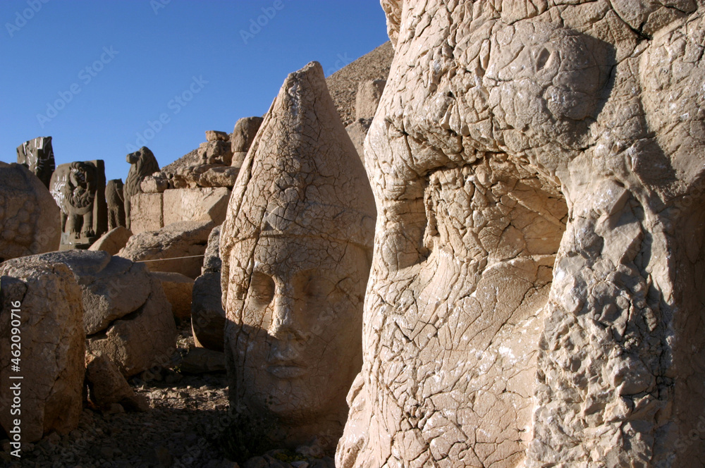 Zeus Statue detail and Mount Nemrut colossal statues guarding ancient tomb, Adiyaman, Turkey. Mount Nemrut in southeastern Turkey and royal tombs is from the 1st century BC.