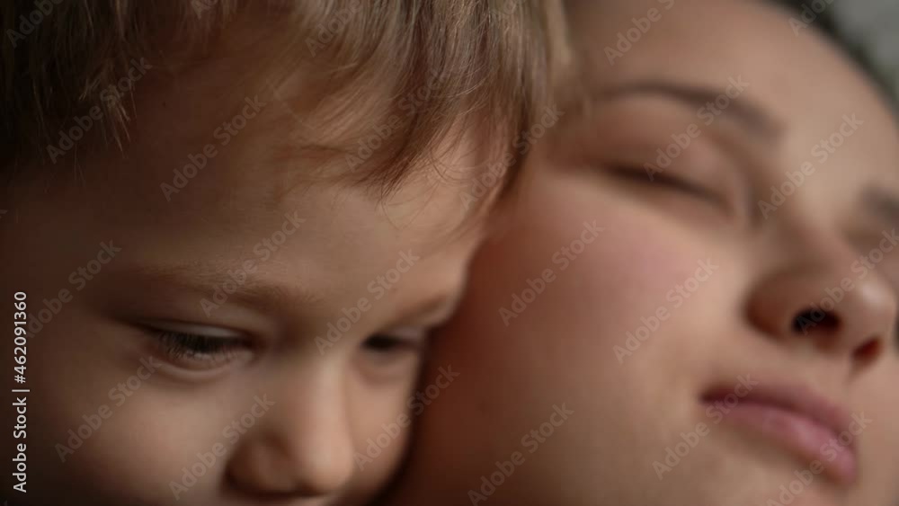 Little cute sleepy small baby tenderly hug kiss taking care relax embrace smiling parent mum mother. Childhood, motherhood, love concept. Children Emotions. Kid Focused Look. Portrait of Caucasian Boy Little cute sleepy small baby tenderly hug kiss taking care relax embrace smiling parent mum mother. Childhood, motherhood, love concept. Children Emotions. Kid Focused Look. Portrait of Caucasian Boy
