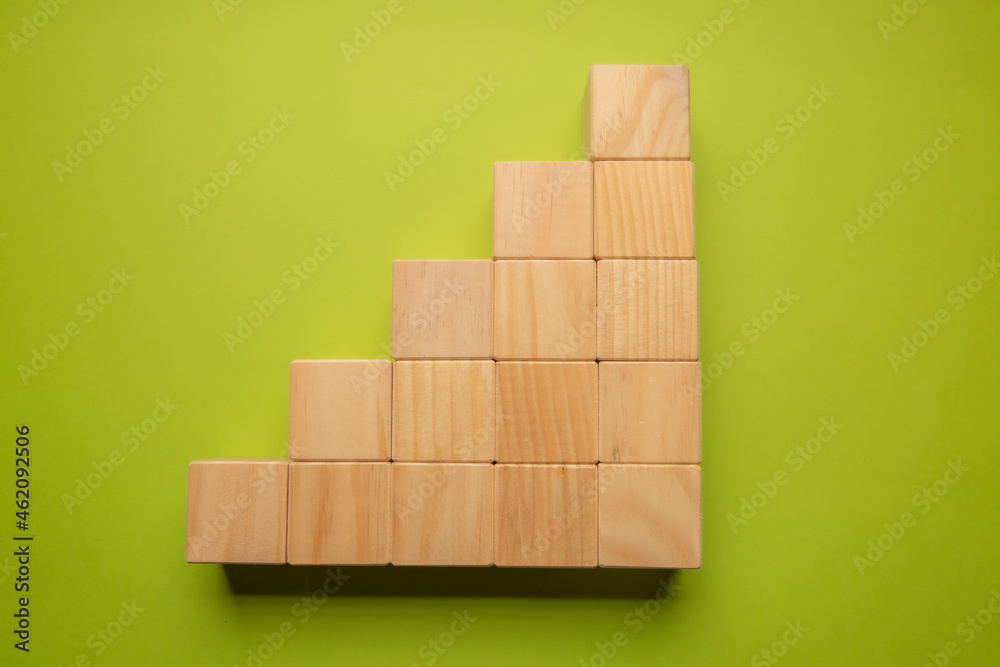 Wooden cubes stacked in the form of statistics