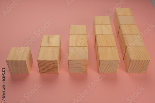Wooden cubes stacked in the form of statistics
