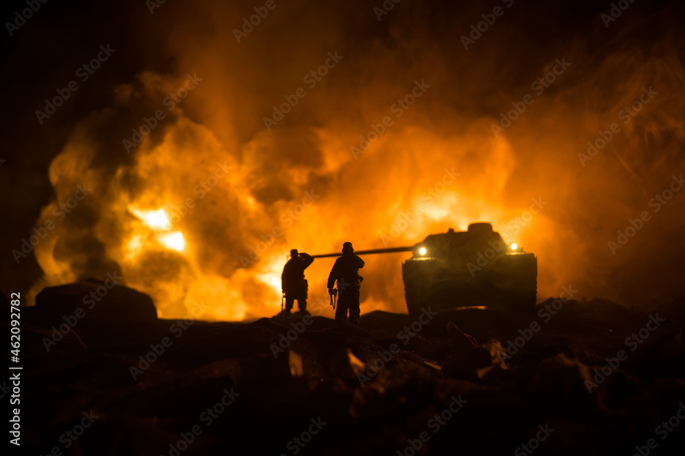 Obraz premium War Concept. Military silhouettes fighting scene on war fog sky background, World War Soldiers Silhouette Below Cloudy Skyline At night. Battle in ruined city. Selective focus
