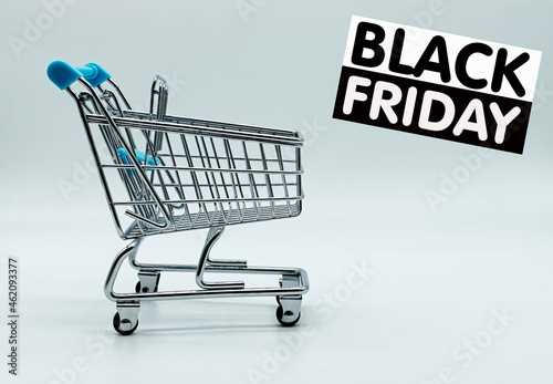 Empty shopping cart with Black Friday sign isolated on white background. Black Friday concept