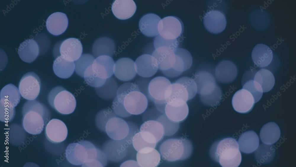 blue blurry christmas lights glow in the dark. abstract festive bokeh background blue blurry christmas lights glow in the dark. abstract festive bokeh background