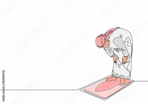 One single line drawing of muslim person pray salat on sajadah at ruku position in shmag traditional Arab cloth. Eid Mubarak greeting card concept continuous line draw design vector illustration