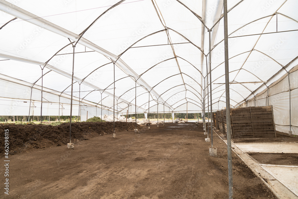 metallic infrastructure of a greenhouse, land ready to cultivate, empty space without people, plantation in the field metallic infrastructure of a greenhouse, land ready to cultivate, empty space without people, plantation in the field