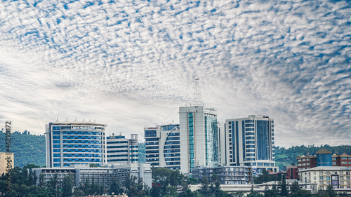 Landscape of modern office buildings under a blue cloudy sky in Kigali, Rwanda photo