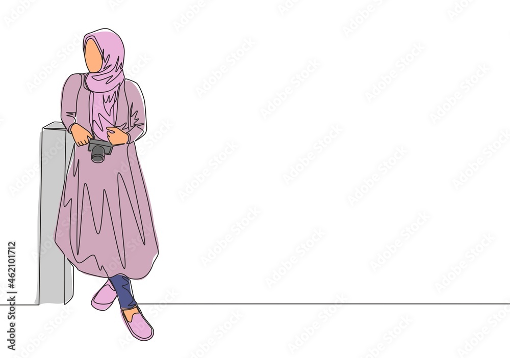 One continuous line drawing of young happy muslim girl with veil leaning on the wall. Pretty beauty middle east women model in trendy hijab fashion concept single line draw design vector illustration One continuous line drawing of young happy muslim girl with veil leaning on the wall. Pretty beauty middle east women model in trendy hijab fashion concept single line draw design vector illustration