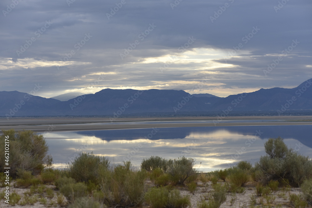 Antelope Island Utah with low water levels in the Great Salt Lake at Sunset on a cloudy evening