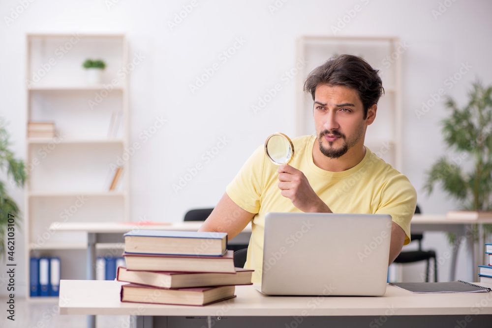 Young male student in telestudying concept