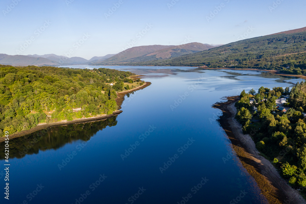 Aerial view of a tranquil Scottish loch in the early morning sunshine (Loch Eil, Fort William)