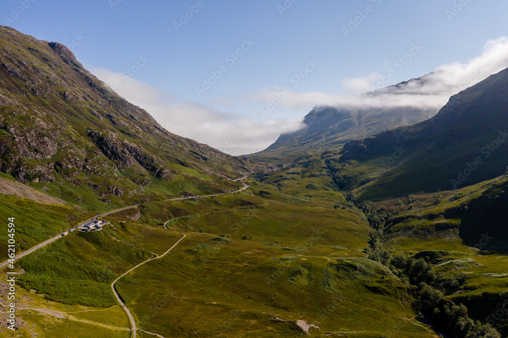 Aerial drone view of the beautiful valley of Glencoe in the Scottish highlands on a clear, sunny day