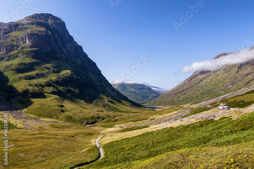 Clouds hanging over the mountain peaks in the beautiful Glencoe valley in the highlands of Scotland