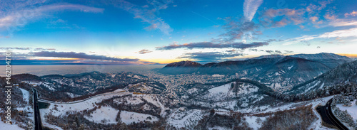 Aerial cityscape over Brasov town in winter time