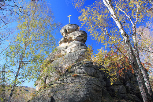 A rock with an Orthodox cross on Mount Tserkovka in the resort town of Belokurikha. Altai. Russia photo