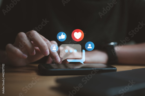 Social media and digital online concept, woman using smart phone. The concept of living on vacation and playing social media. Social Distancing ,Working From Home concept. photo