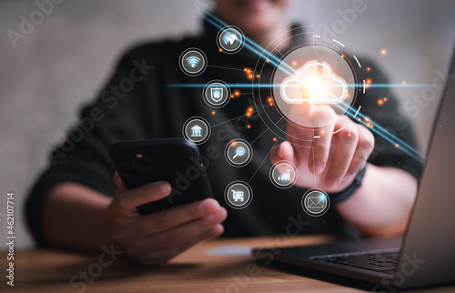 Fotografie Hand touching infographic cloud computing and technology icons , cloud technology is centralize collect lifestyle and confidential information such as internet banking , password and shopping