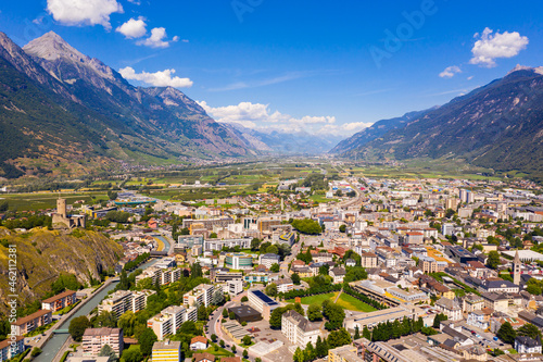 Fotografie Aerial view of Martigny modern cityscape in Rhone Valley at foot of Swiss Alps i