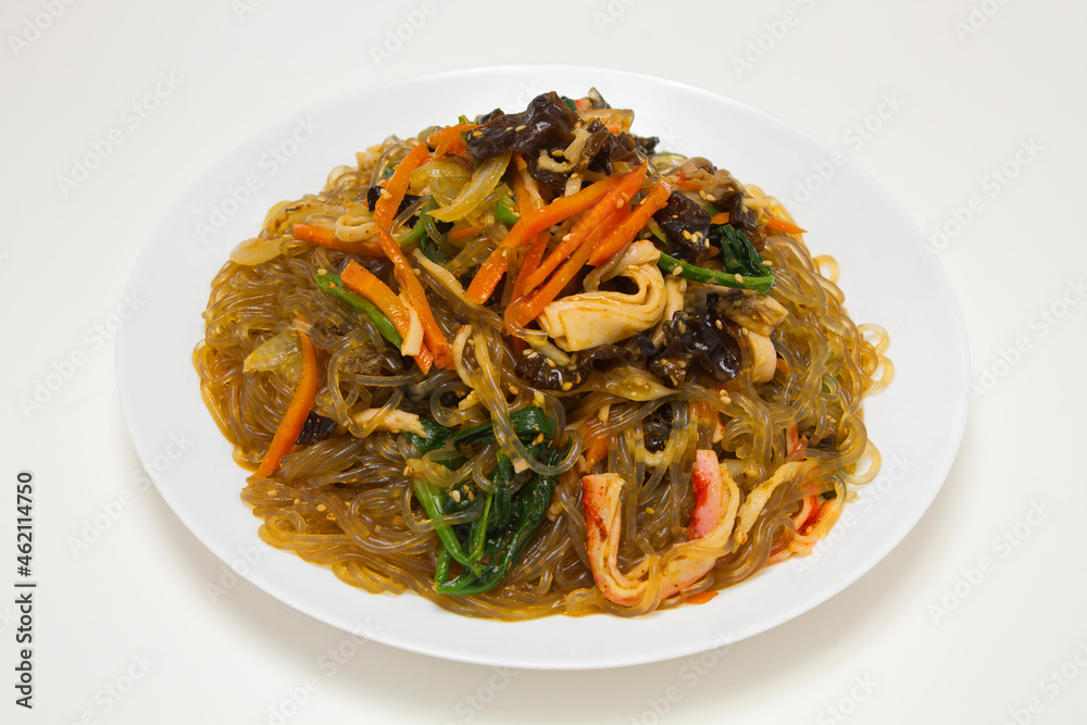 Korean traditional holiday food 'Japchae'. Consisting of cellophane noodles made from sweet potato starch, stir-fried with vegetables. Isolated on white background.
Korean traditional holiday food 'Japchae'. Consisting of cellophane noodles made from sweet potato starch, stir-fried with vegetables. Isolated on white background.