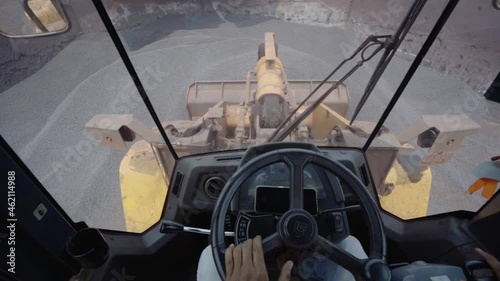 FPV view of a Bulldozer lifting coal at a mine in India - POV shot photo