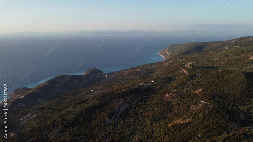 Aerial: Hill island forest with vast blue Sea at Lefkada, Greece - drone flying top wide shot Aerial: Hill island forest with vast blue Sea at Lefkada, Greece - drone flying top wide shot