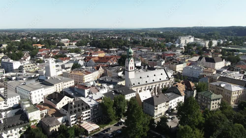 Aerial shot of the city of Rosenheim showing the Neogothic
St. Nikolaus Church flying backwards revealing the
beautiful old town with it’s parks, restaurants and the
pedestrian zone. Aerial shot of the city of Rosenheim showing the Neogothic
St. Nikolaus Church flying backwards revealing the
beautiful old town with it’s parks, restaurants and the
pedestrian zone.