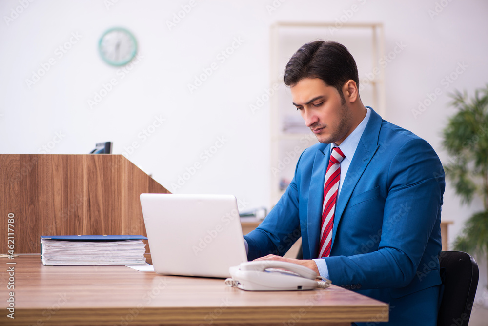 Young businessman employee working in the office Young businessman employee working in the office