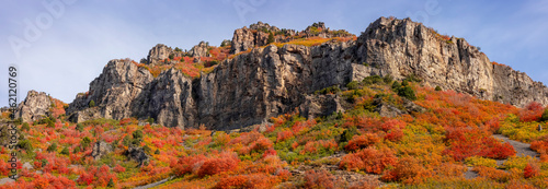 Panoramic view of Wasatch mountain peaks surrounded with fall foliage on the slopes in Utah photo