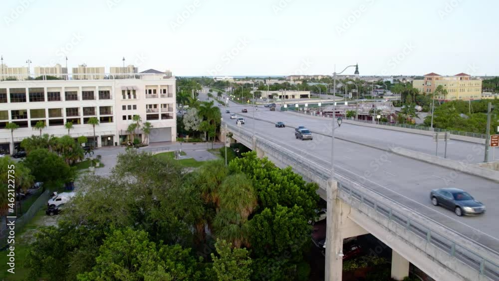 Aerial view of traffic on a bridge, freeway 706, in Jupiter, Florida - reverse, drone shot Aerial view of traffic on a bridge, freeway 706, in Jupiter, Florida - reverse, drone shot