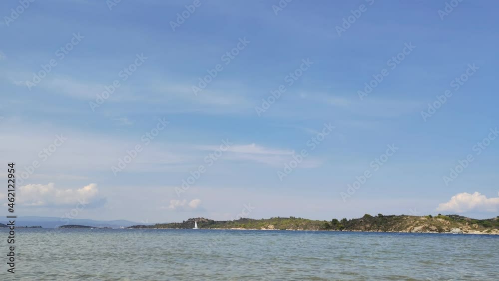 Motion lapse timelapse of a tropical bay in Vourvourou in Halkidiki, northern Greece Motion lapse timelapse of a tropical bay in Vourvourou in Halkidiki, northern Greece