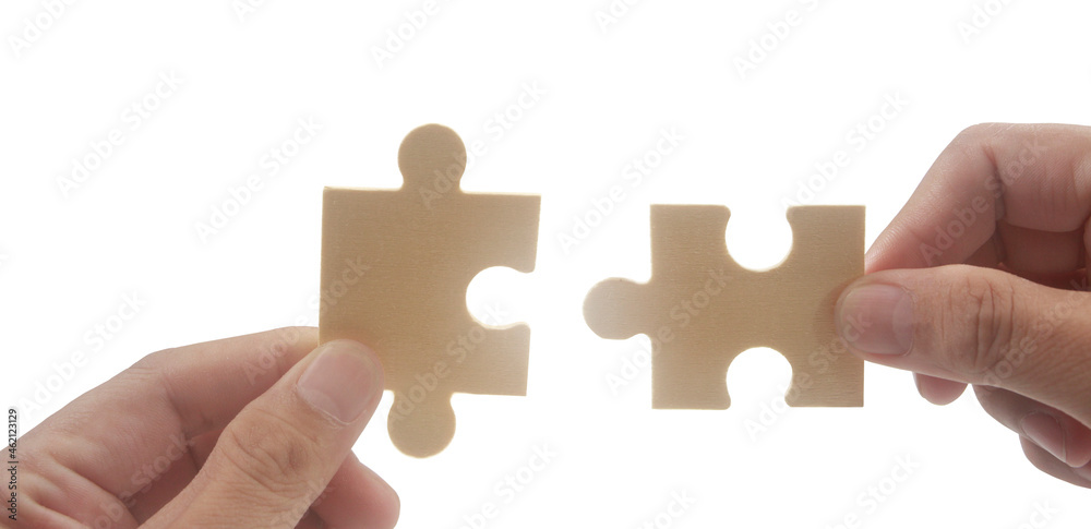 Connecting jigsaw puzzle. Business solutions success and strategy concept Connecting jigsaw puzzle. Business solutions success and strategy concept