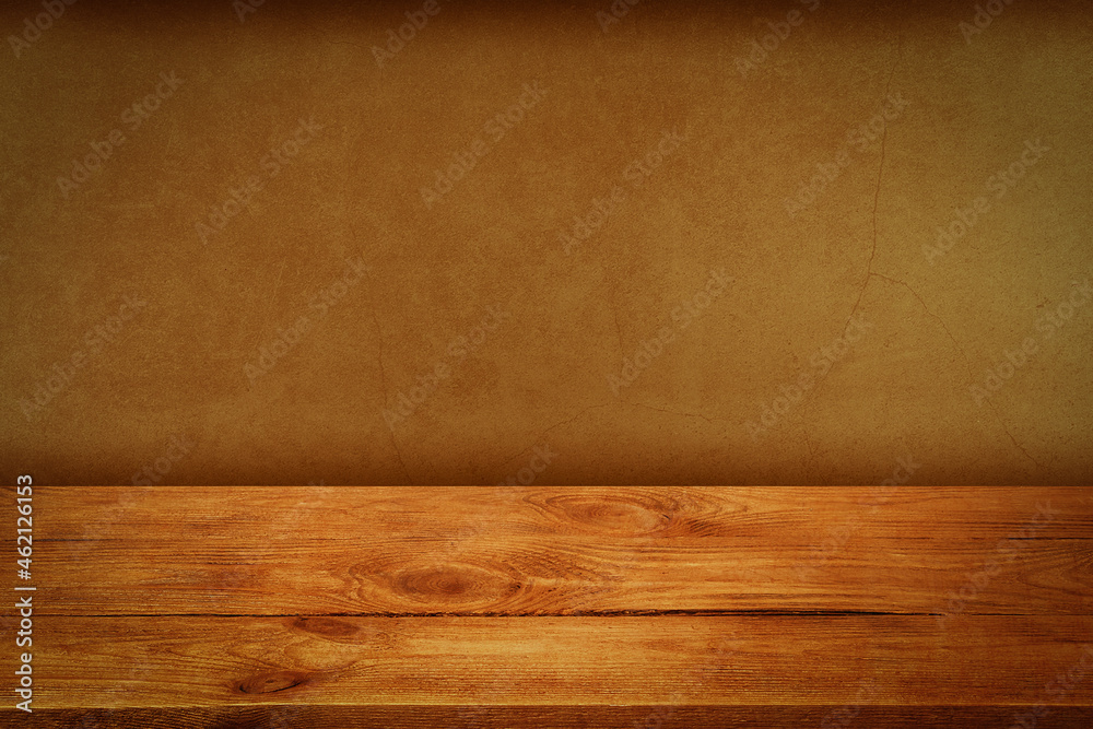 The background is blank wooden boards and a textured plastered wall with lighting and vignetting. The background is blank wooden boards and a textured plastered wall with lighting and vignetting.