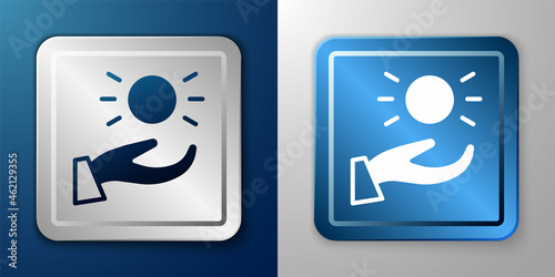 White Ball levitating above hand icon isolated on blue and grey background. Levitation symbol. Silver and blue square button. Vector