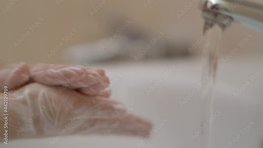 Little Girl Washing Hands With Soap Over Sink in Bathroom. Woman Washing Hands Rubbing With Soap. Child For Corona Virus Prevention, Hygiene to Stop Spreading Coronavirus. Slow Motion. Little Girl Washing Hands With Soap Over Sink in Bathroom. Woman Washing Hands Rubbing With Soap. Child For Corona Virus Prevention, Hygiene to Stop Spreading Coronavirus. Slow Motion.