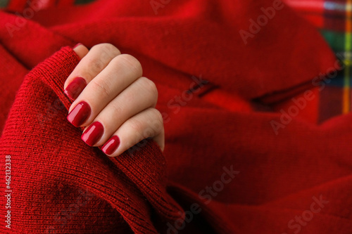 Fotomurale Woman manicured hands, stylish red nails, copy space