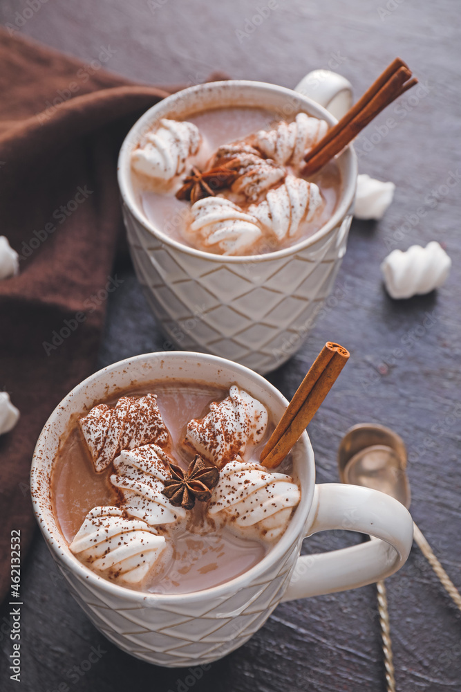 Cups of hot cocoa drink and marshmallows on dark background Cups of hot cocoa drink and marshmallows on dark background