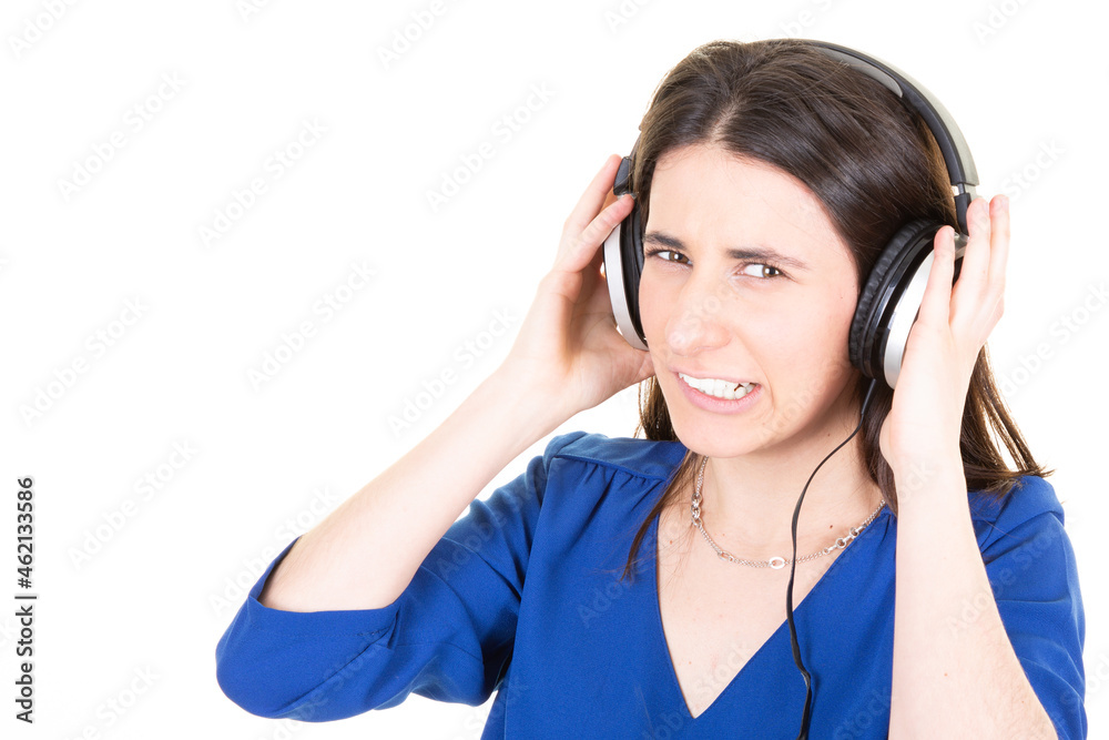 teenager woman with headphones on head looking at camera bad music isolated on white background teenager woman with headphones on head looking at camera bad music isolated on white background