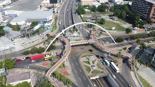 Top view of drone flying over the main street maximo gomez in the city of santo domingo, light traffic with cars waiting for traffic light. photo