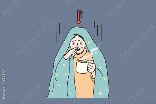 Unhealthy man covered in blanket feel sick unwell suffer with high temperature drink hot tea. Ill male struggle with flu or fever, have covid-19 symptoms. Corona concept. Flat vector illustration.