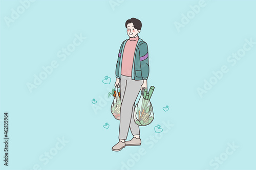 Smiling young man character with bags shopping in grocery store. Happy millennial male buy purchase food vegetables at market or shop. Healthy eating concept. Cartoon flat vector illustration.