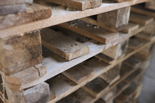 Construction wooden pallets are stacked together closeup