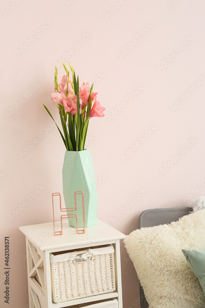 Vase with gladiolus flowers in room Vase with gladiolus flowers in room