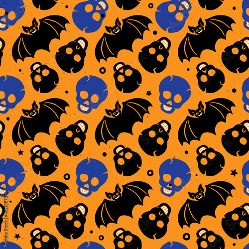 Cute and scary Halloween seamless pattern. Skulls and bats in cartoon style on a yellow background. Set of vector flat hand drawn holiday symbols photo