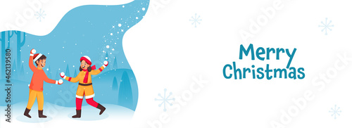 Cheerful Kids Playing With Snowballs On White And Blue Natural Background For Merry Christmas Concept.