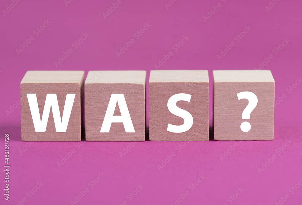 The german word for what is standing on wooden cubes, pink colored background The german word for what is standing on wooden cubes, pink colored background