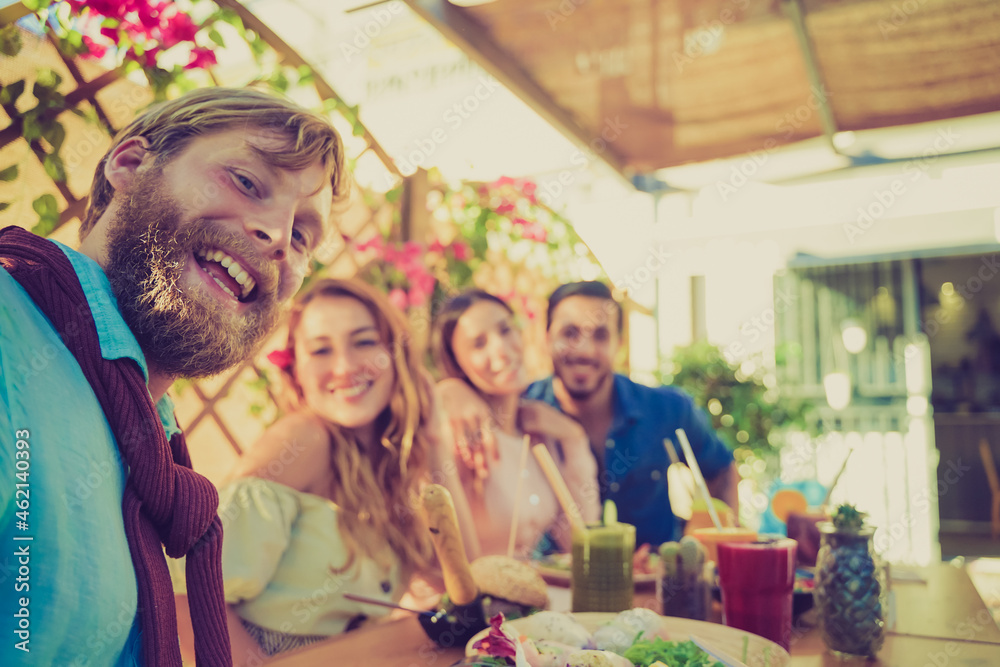 Loving cheerful happy couples taking selfie in the vegan restaurant. Food, drink, love and friendship concept. Loving cheerful happy couples taking selfie in the vegan restaurant. Food, drink, love and friendship concept.