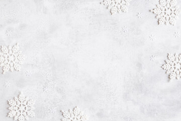 Christmas composition. Frame made of snowflakes on gray background. Christmas, winter, new year concept. Flat lay, top view